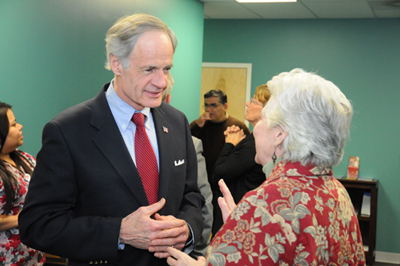 Senator Carper talks with newly insured Christine Brooks about her experience enrolling in a marketplace plan